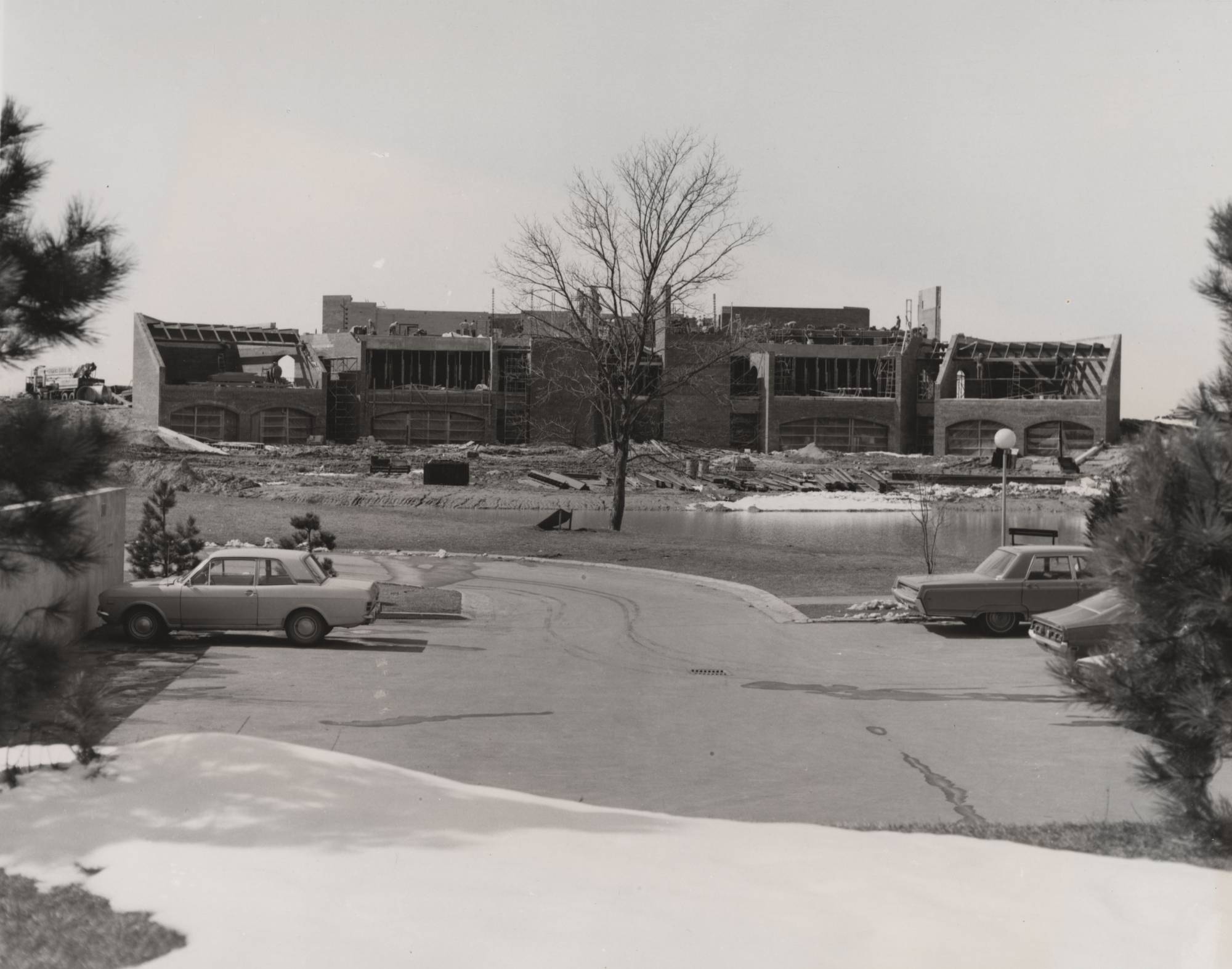 View from Zumberge Library across the pond of Kirkhof Center under construction, ca. 1974.